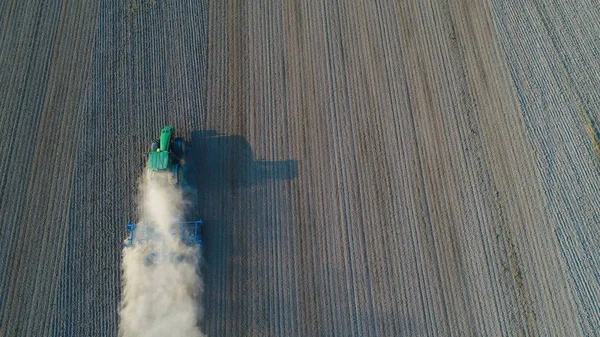 Aerial view on tractor ploughing field. — Stock Photo, Image