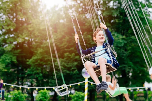 Happy child boy having fun in amusement park. — Stock Photo, Image