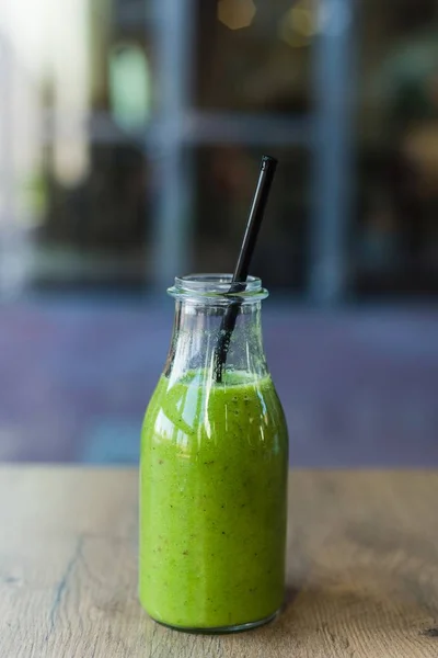 Delicious carrot green spinach, mango and banana cocktail — Stock Photo, Image