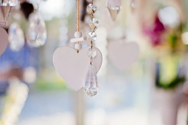 Hanging white wooden heart with transparent crystals — Stock Photo, Image