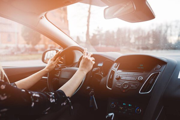 Young woman driving a car.