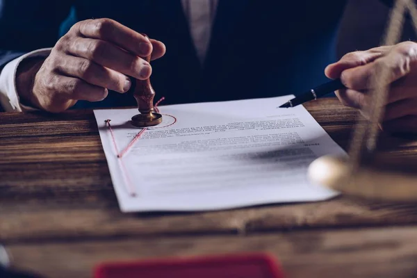 Male lawyer or notary stamping document at his office. — Stock Photo, Image