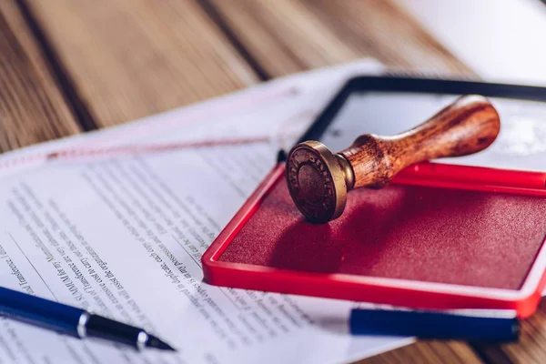 Red ink stamp on the document — Stock Photo, Image