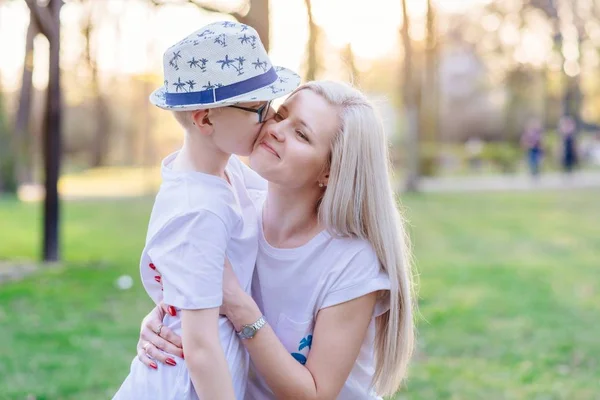 Son kissing his mother. Mother's Day.