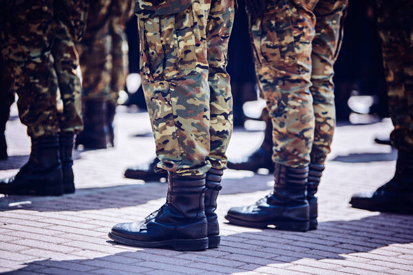 Soldiers in masking camouflage uniforms on parade