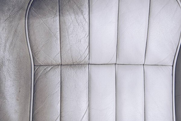 Before and after effect of cleaning leather car seat.