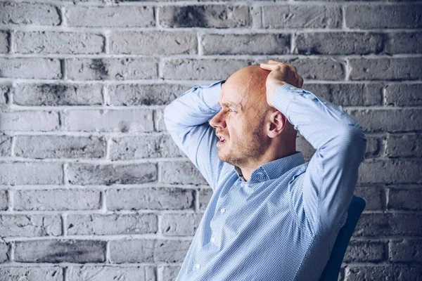 Worried confused man in shirt working in the office — Stock Photo, Image
