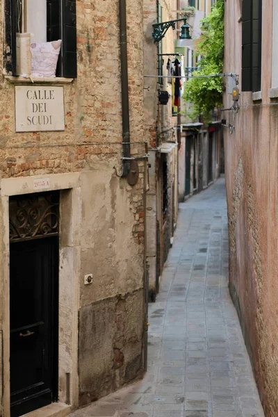 Quiet Venetian street without people. Narrow street.