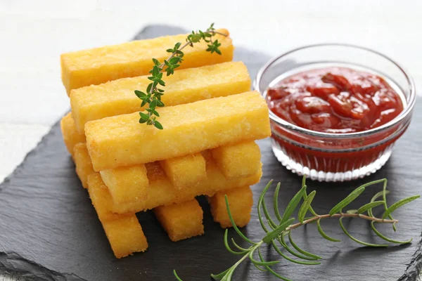 Fried polenta with dipping sauce — Stock Photo, Image