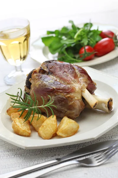 Pork shank with roasted potatoes, italian cuisine — Stock Photo, Image