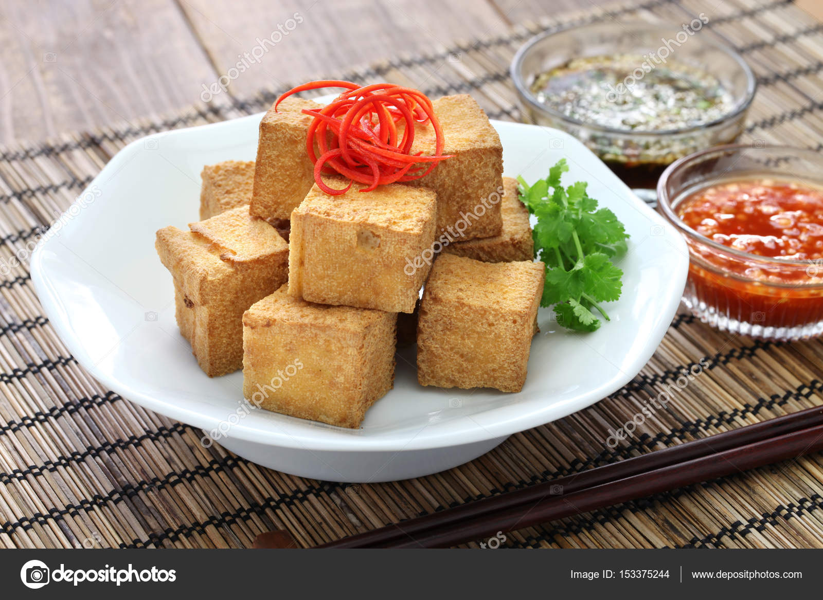 Fried tofu with dipping sauce Stock Photo by ©asimojet 153375244