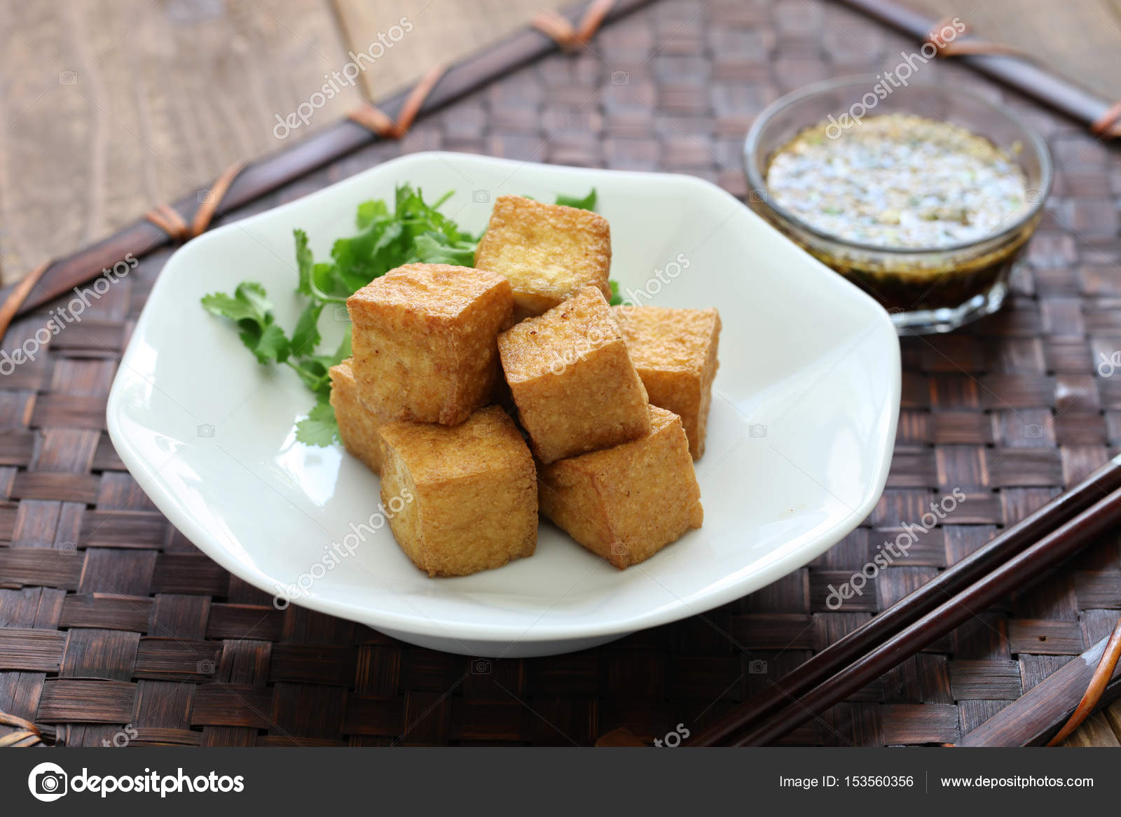 Fried tofu with dipping sauce Stock Photo by ©asimojet 153560356