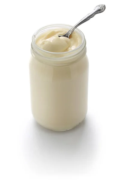 Scoop up mayonnaise with a spoon — Stock Photo, Image