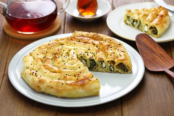 stock image homemade rolled borek, spinach and feta cheese, turkish cuisine