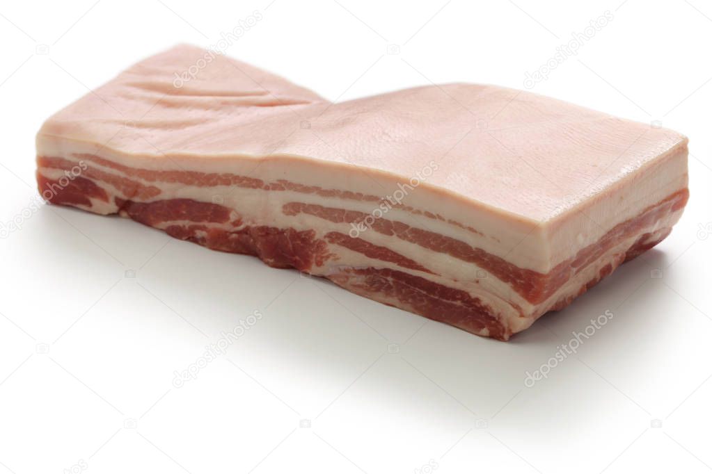 raw pork belly with rind isolated on white background