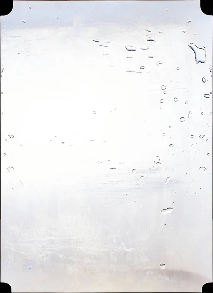 Steel panel of a kitchen splashed with water. — Stock Photo, Image