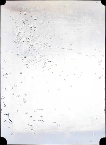 Steel panel of a kitchen splashed with water. — Stock Photo, Image