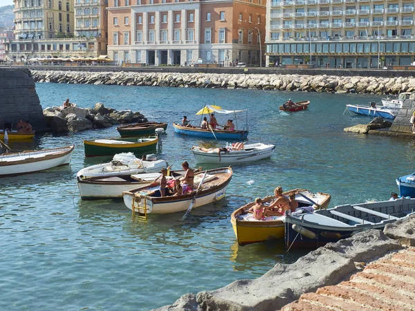 Sunbathing in fishing boats of Borgo Marinari. Naples. Italy. — Stock Photo, Image