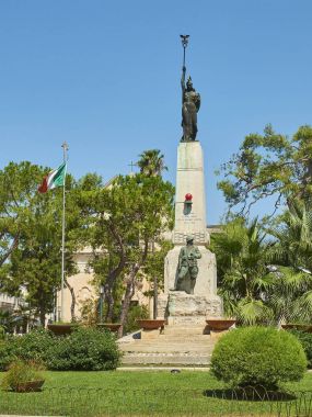 War memorial monument in Piazza Dante Alighieri. Galatina, Apulia, Italy. clipart
