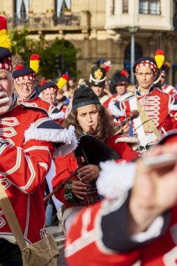 Soldiers playing bagpipe in Tamborrada of San Sebastian. Basque Country, Spain. clipart