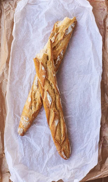 Loaf of bread on a grocery paper bag. — Stock Photo, Image