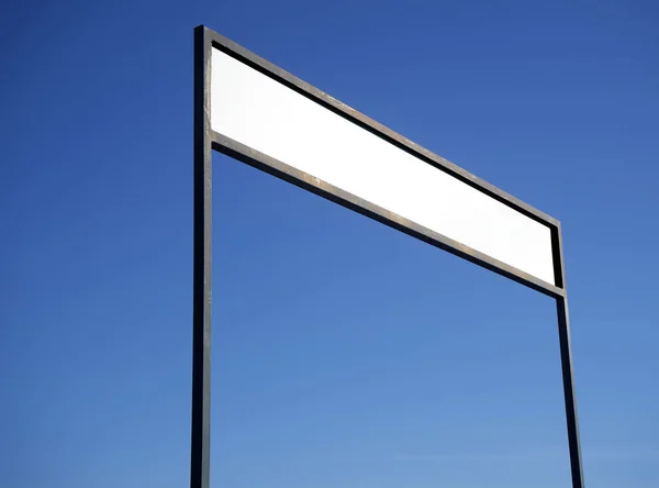 Blank signboard on blue sky background. — 스톡 사진