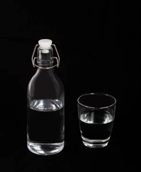 Bottle of water and a glass — Stock Photo, Image