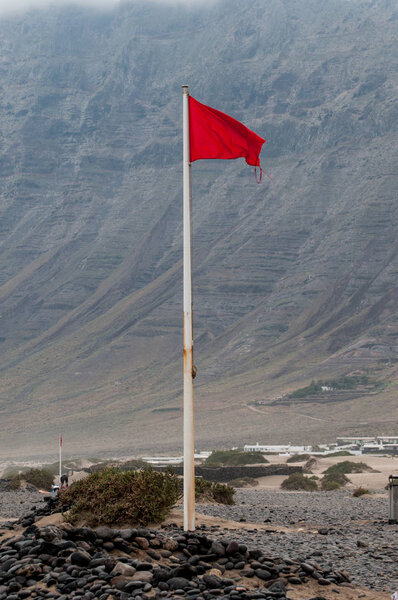red flag on a beach