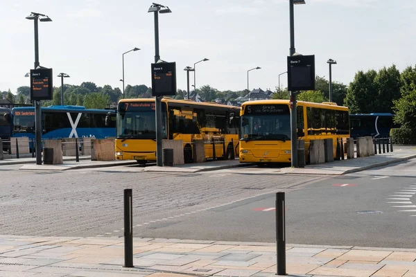 Orange pubblic bus at the bus station in Vejle Denmark