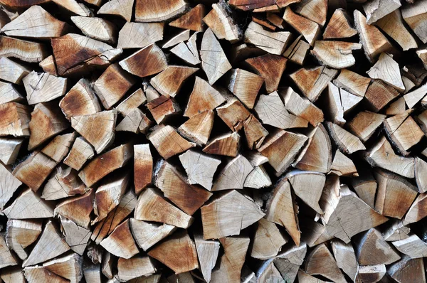 Dry chopped firewood in storage ready for use in cold winter sea — Stock Photo, Image