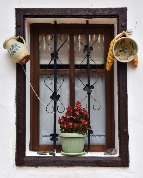 Vintage wooden window frame with hanged pottery — Stock Photo, Image