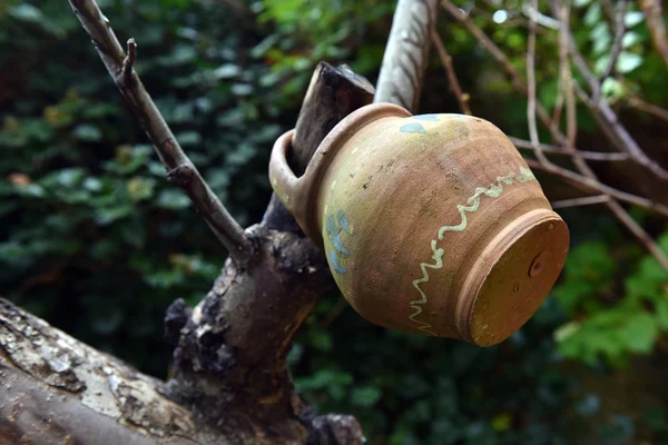 Hanging old ceramic jug — Stock Photo, Image