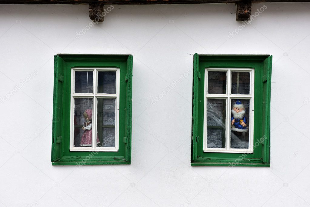 Dolls in the window in a village house