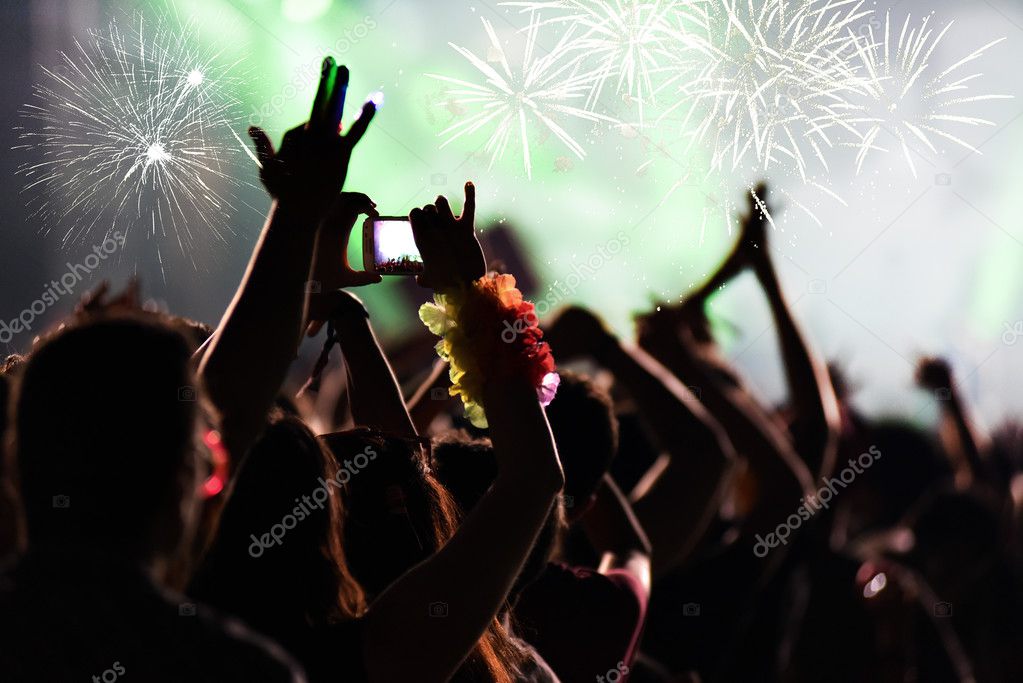 Cheering crowd and fireworks - New Year concept