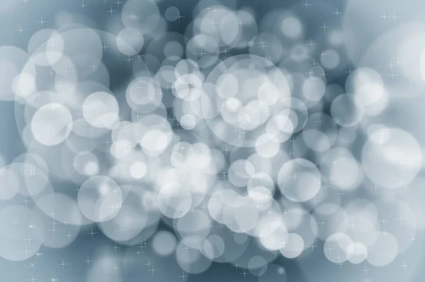 Χριστούγεννα έννοια μπλε φόντο με νιφάδες και λάμπει — Φωτογραφία Αρχείου