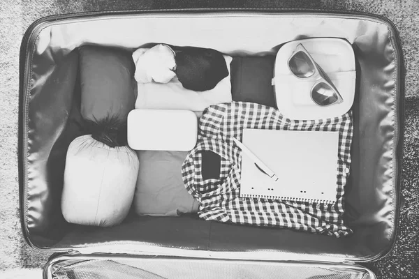 Travel accessories in a suitcase. Vintage toned — Stock Photo, Image