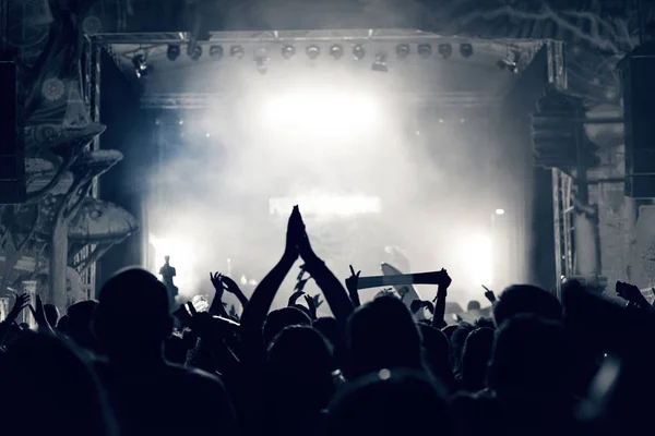 Crowd at a music concert, audience raising hands up, toned — Stock Photo, Image