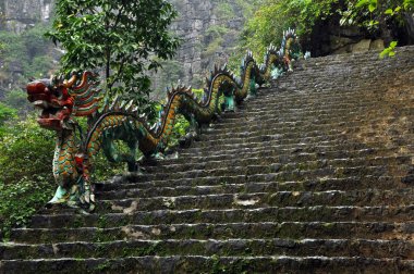 Carved stone dragon. Ascending staircase to Hang Mua pagoda, Nin clipart