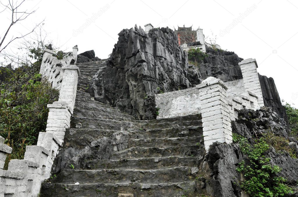 Ascending stone staircase to Hang Mua pagoda, Ninh Binh, Vietnam