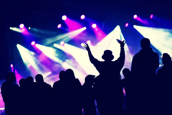 Crowd at a music concert, audience raising hands up — Stock Photo, Image