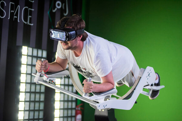 Guy using Samsung virtual reality headset, VR oculus googles