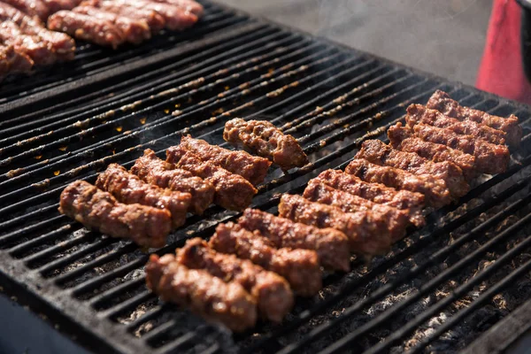 Meat rolls (mititei, mici) on grill