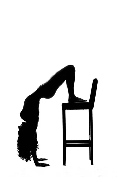 Silhouette of a sexy pole dancer isolated on white — Stock Photo, Image