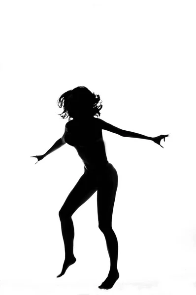 Silhouette einer sexy Pole-Tänzerin isoliert auf weiß — Stockfoto