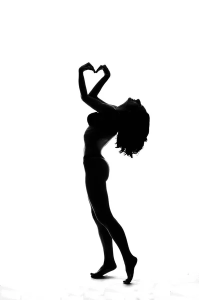 Silhouette di una ballerina pole sexy isolata sul bianco — Foto Stock