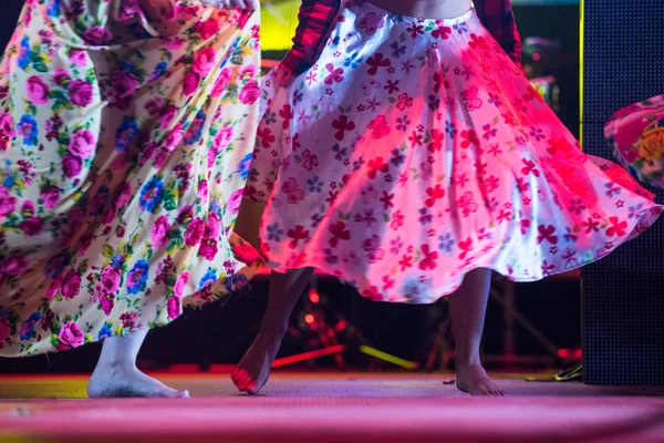 Young dancer woman barefoot in gypsy dress dancing on stage — Stock Photo, Image