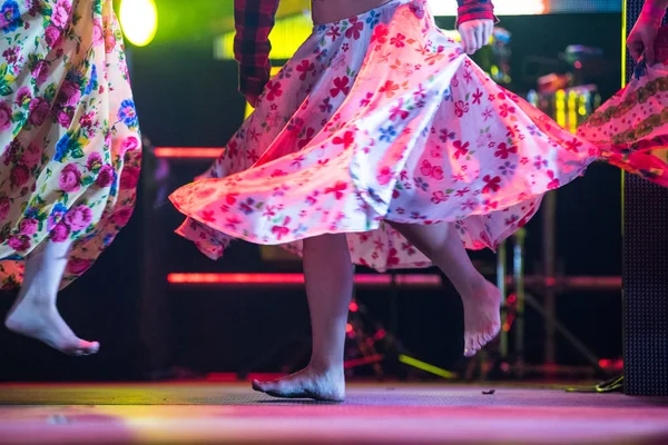 Young dancer woman barefoot in gypsy dress dancing on stage — Stock Photo, Image