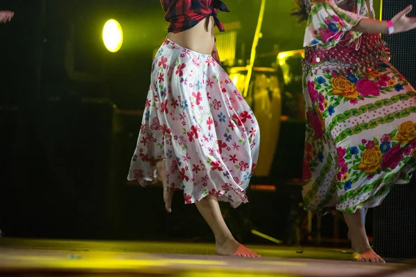 Young dancer woman barefoot in gypsy dress dancing on stage — Stock Photo, Image