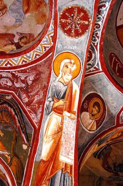 Frescos and murals in a cave chapel clipart