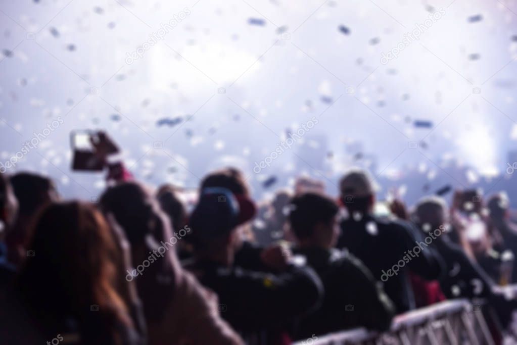 Blurred crowd of people at music festival